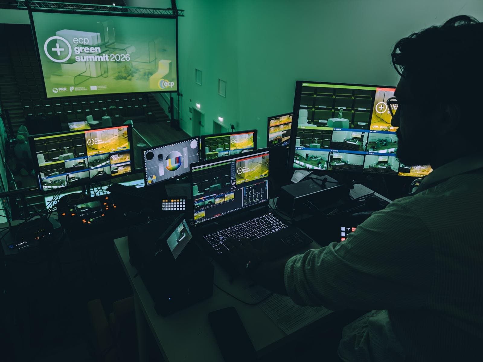 The ECP Green Summit control room, with Rafael Reigota in profile in front of the six-camera multiview and the event screen in the background